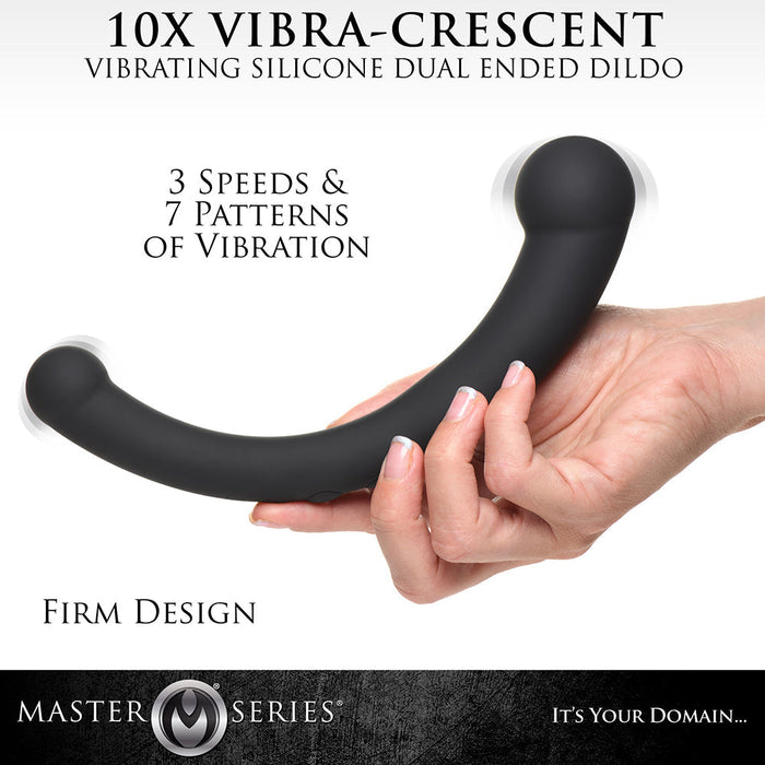 A promotional image for the Vibra Crescent Powerful Silicone Double Ended Vibrator by XR Brands, a vibrating silicone and ABS plastic dual-ended dildo. The black, curved Crescent vibrator is shown being held by a hand. Text highlights features including 3 speeds, 7 patterns of powerful vibrations, and a firm design.