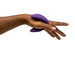 A close-up of a hand holding the We-Vibe Chorus Remote & App Controlled Couples' Vibrator in purple, which features a smooth material and an adjustable fit design with buttons. The background is white, emphasizing the hand and the object.