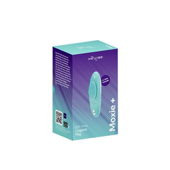 The image displays a turquoise box of the We-Vibe Moxie + Hands-Free Remote or App Controlled Panty Vibrator - Teal, designed specifically for lingerie play. The packaging features wave-like patterns and showcases an image of the panty vibrator inside. It highlights "10+ modes," is remote-controlled, and includes a QR code on the side.