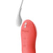 Close-up image of the We-Vibe Touch X Lay On Vibrator - Coral, a coral-colored, curved device made from premium silicone with a white cord attached. It features three buttons (+, -, and a central button) and has "We-Vibe" elegantly embossed on it. The waterproof design includes a small white component on the cord, all set against a white background.