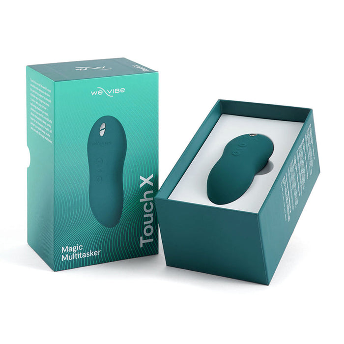 The image features a We-Vibe Touch X Lay-On Vibrator in green, showcasing its smooth silicone coating. The product is displayed both inside its packaging and outside on a white surface. The packaging highlights the product name and the brand We-Vibe. This chic, rounded lay-on vibrator is also waterproof.