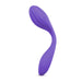 A purple, curved Blush Wellness Duo Hands Free Wearable and Couples Vibrator, crafted from Puria™ silicone with a smooth finish and a distinct bend in the middle, designed for ergonomic use and featuring various vibration functions.