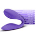 The Wellness Duo Hands Free Wearable and Couples Vibrator by Blush is a purple, S-shaped toy designed for both G-spot and clitoral stimulation. It features 10 powerful vibration functions, an Ultrasilk smooth surface, Magna Charge technology, Puria™ revolutionary silicone, dual-ended vibration capabilities, and comes with a 1-year warranty.