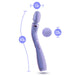 An image of the Blush Wellness Eternal Slim Ergonomic Powerful Remote Control Wand in Lavender, featuring a rounded head with a 1.5-inch diameter, an ergonomic handle that measures 14.5 inches in length, and a circular accessory measuring 2.25 inches. The waterproof handle has two buttons for convenient control options.