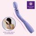 Image of the Blush Wellness Eternal Slim Ergonomic Powerful Remote Control Wand in Lavender, featuring a curved ergonomic design. A small inset shows a person using the waterproof massager on their back. Text indicates "Extra Long Reach & Lightweight" and "Ergonomic Design." Background is light pink.