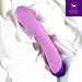 A smooth, purple Wellness G Curve Rumbly Waterproof Silicone G-Spot Vibrator from Blush rests on a white fabric background. With its sleek and curved design perfect for G-spot exploration, the device features control buttons near the base. A purple icon in the top right corner reads "ULTRASILK™ SILICONE".