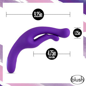 An image of a purple Wellness G Wave Waterproof Rabbit Vibrator with an ergonomic handle, featuring two prongs. Measurements are displayed: 9.25 inches in length, 1.25 inches in width, and 4.75 inches insertable length. The brand "Blush" is shown in the bottom right corner.
