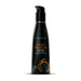 A bottle of Wicked Lubes' Wicked Aqua Sweet Peach Flavored Water Based Lubricant, featuring a paraben-free formula and a convenient pump dispenser. This black bottle with orange text and a peach graphic contains 120 ml or 4.0 fl oz of sugar-free sweet peach lube.