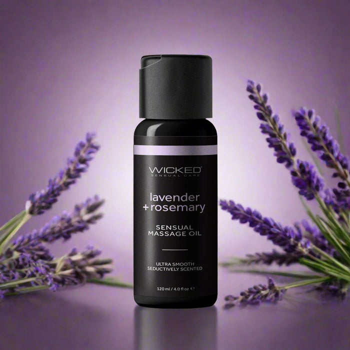 The Wicked Lubes Wicked Lavender & Rosemary Sensual Massage Oil comes in an elegant 4 oz black bottle adorned with "lavender rosemary" on the label, enriched with moisturizing natural oils. The sophisticated design features a black cap and prominently displays "sensual massage oil.