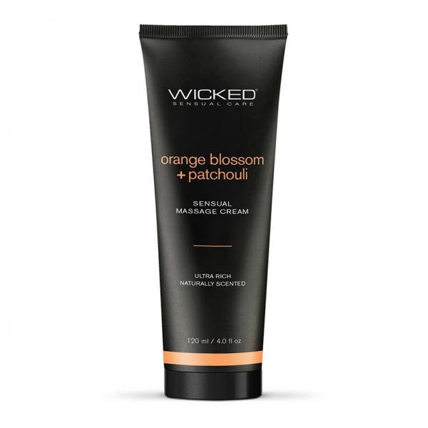 A 120 ml tube of Wicked Sensual Orange Blossom & Patchouli Massage Cream from the brand "Wicked Lubes." The label reads "orange blossom + patchouli" and "sensual massage cream, ultra rich, naturally scented." The sleek black tube features vibrant orange and white text.