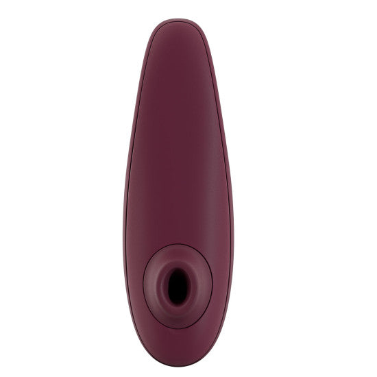 The Womanizer Classic 2 Pleasure Air Clitoral Stimulator by Womanizer comes in a sleek, oval-shaped design with a Bordeaux hue. This handheld electronic device features an advanced clitoral air pulsation technology and smooth surface, tailored for personal care or wellness. Additionally, it boasts waterproof capabilities for easy cleaning and versatile use.