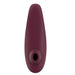 The Womanizer Classic 2 Pleasure Air Clitoral Stimulator by Womanizer comes in a sleek, oval-shaped design with a Bordeaux hue. This handheld electronic device features an advanced clitoral air pulsation technology and smooth surface, tailored for personal care or wellness. Additionally, it boasts waterproof capabilities for easy cleaning and versatile use.