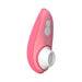 The Womanizer Liberty 2 Pleasure Air Travel Sized Clitoral Stimulator - Rose, by Womanizer, is a pink handheld device with a white circular attachment at the base and two side buttons for controlling its functions, utilizing Clitoral Pleasure Air Technology.