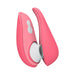 The Womanizer Liberty 2 Pleasure Air Travel Sized Clitoral Stimulator - Rose by Womanizer is a sleek, handheld device in pink, designed with smooth curves and two buttons on its surface. This portable vibrator features a white circular opening at the top and utilizes Clitoral Pleasure Air Technology for personal use.