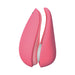 This is an image of the Womanizer Liberty 2 Pleasure Air Travel Sized Clitoral Stimulator - Rose. The compact device from Womanizer is petal-shaped, dual-sided with smooth curves, modern and ergonomic in design. It features a split in the middle and a small indicator light near the top.