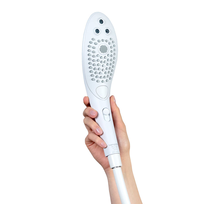 A hand holding the elegant Womanizer Wave Water Pulsing Shower Masturbator (White) by Womanizer, featuring multiple water nozzles and a central button. This sleek shower head, perfect for enhancing your self-care routine, has an elongated teardrop shape, and the person's nails are neatly manicured in a light color.