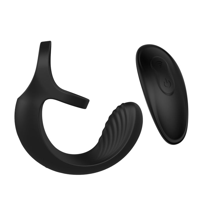 The Zero Tolerance Vibrating Black Ball Cradle by Evolved Novelties is a black silicone vibrator featuring a curved shape and ribbed inner surface, accompanied by a detached, oval-shaped remote control with two buttons. Its sleek design and waterproof feature make it ideal for intimate massage purposes.