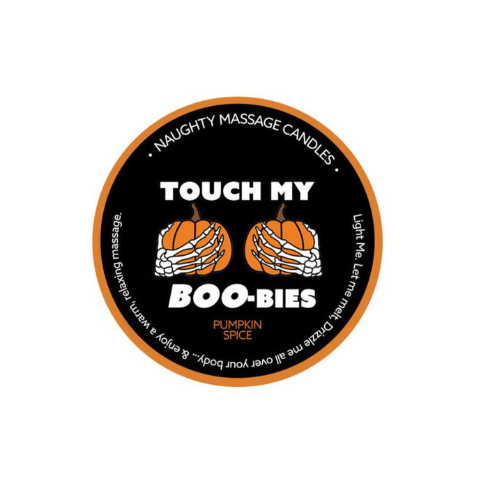 A round label for "Kama Sutra's Pumpkin Spice Erotic Massage Candle - Touch My Boo-bies," which is coconut oil-based and features skeleton hands holding pumpkins with playful text. The border reads "Naughty Massage Candles" and includes the instructions, "Light me, let me melt, then drizzle me all over your body & enjoy the warm erotic massage.