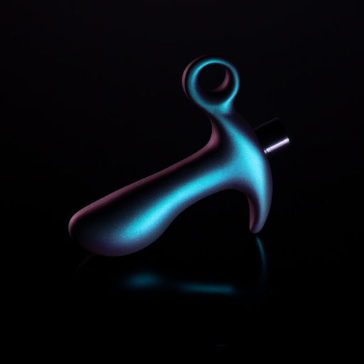 A sleek Blush Teleportation Vibrating Silicone Prostate Massager & Butt Plug in metallic blue, featuring a curved, ergonomic design, rests against a dark background. Its handle with a loop creates a modern, abstract silhouette.