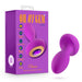 Image of the Blush Charm Vibrating Textured Silicone Butt Plug in Amethyst next to its box. The box features text describing product highlights such as "Cushy Feel," "7 Powerful Vibration Modes," "Rippled Design," "Magnetic Charging," "Ultra Soft Platinum Cured Silicone," and "1 Year Warranty.