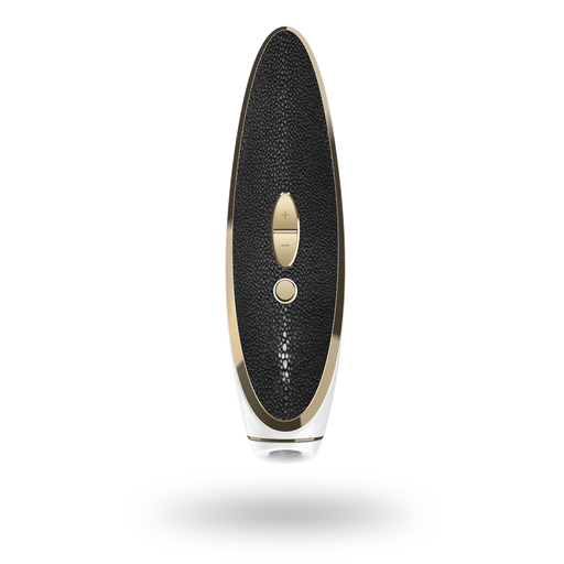 Introducing the Satisfyer Luxury Air Pulsation + Vibration in Gold & Black Leather: This sophisticated pressure wave vibrator boasts a luxurious black and gold oval design with a textured ergonomic handle. It includes two buttons on the front, one large and one small, while the bottom features a transparent section for added elegance. Brought to you by Satisfyer, this product combines style and functionality seamlessly.