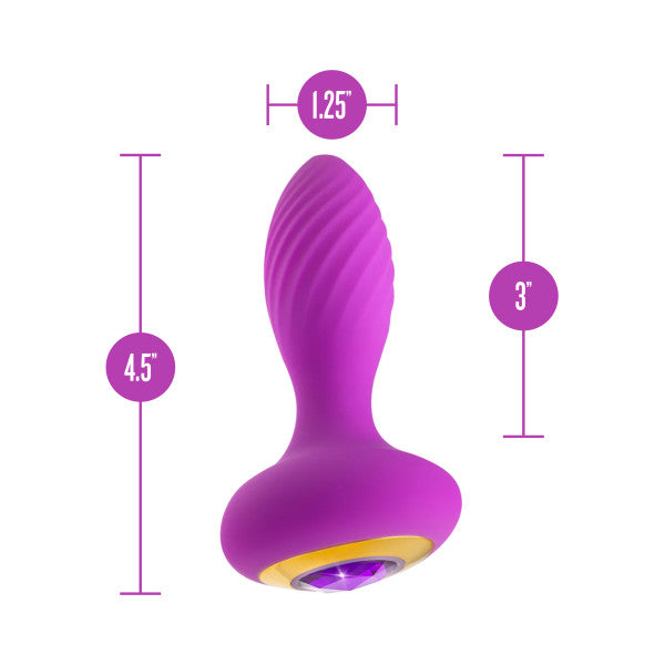 Introducing the Charm Vibrating Textured Silicone Butt Plug in Amethyst by Blush—a stunning purple, platinum-cured silicone butt plug featuring a ribbed texture and elegant gold accents. With dimensions of 1.25 inches in diameter at the widest point, 3 inches insertable length, and a total length of 4.5 inches from base to top, this extraordinary butt plug is perfect for both beginners and enthusiasts alike.