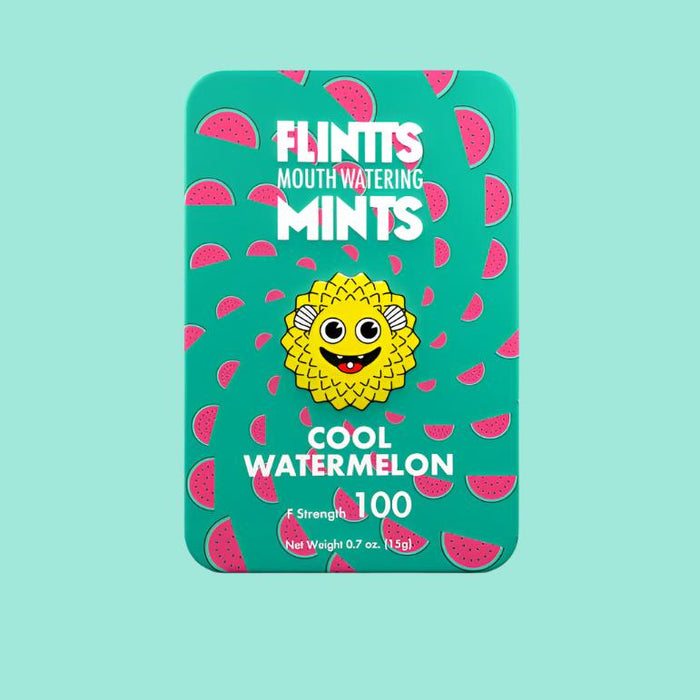 A green tin box labeled "Flintts Mints" showcases a watermelon design accompanied by an adorable cartoon face. It prominently displays "Cool Watermelon," emphasizing its effectiveness as a dry mouth remedy with a strength level of 100. Weighing 0.7 oz (19.5g), these mints are infused with Spilanthes flower.